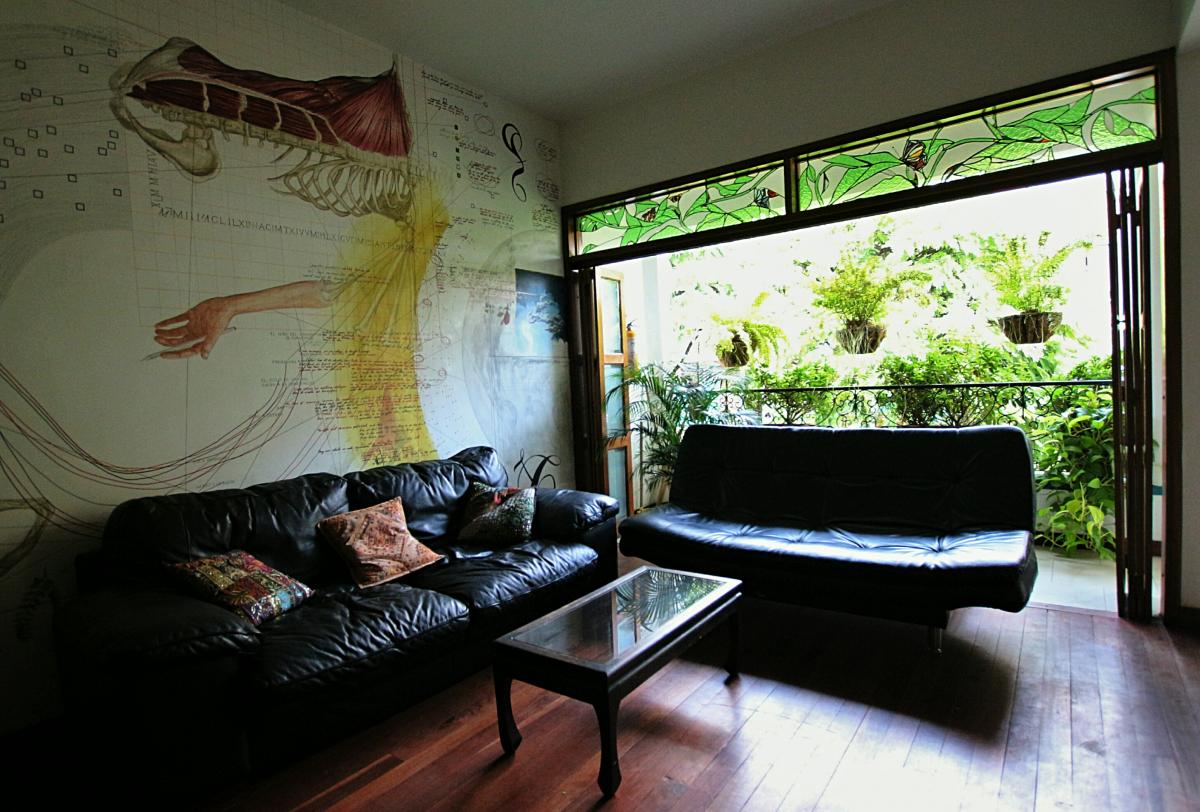 A retreat space, plants and light through open doors